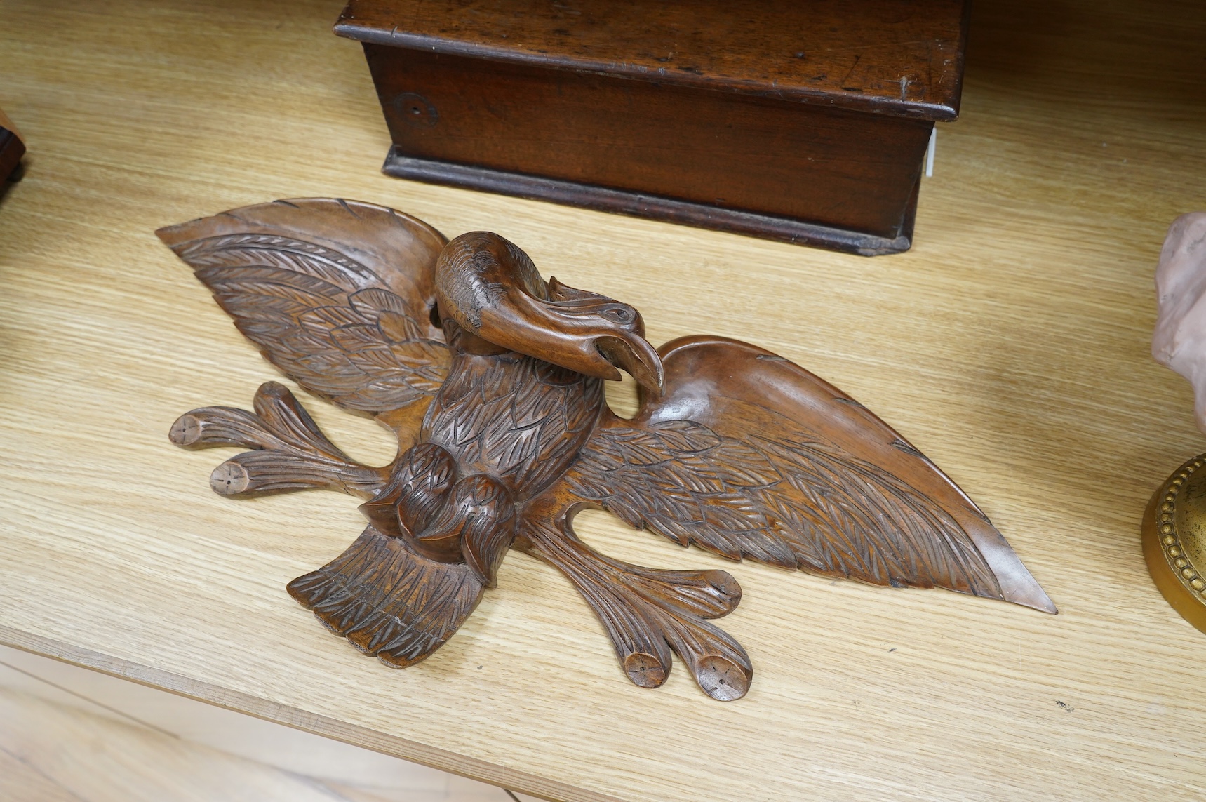A mahogany leather-handled tool box and carved American eagle wall mount, largest 66cm wide